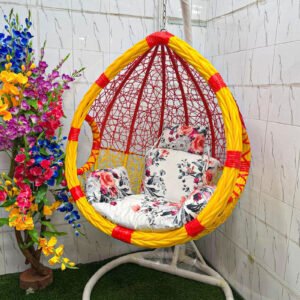 "Premium hanging egg swing chair with stand, yellow and red PE rattan design, white floral cushions, heavy-duty steel frame, 180 kg capacity, perfect for balcony, garden, patio, and living room."