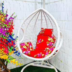 Premium white hanging egg swing chair with luxury red floral cushions, heavy-duty metal stand, PE rattan basket, 180 kg weight capacity, ideal for indoor and outdoor use in balcony, garden, rooftop and living room.